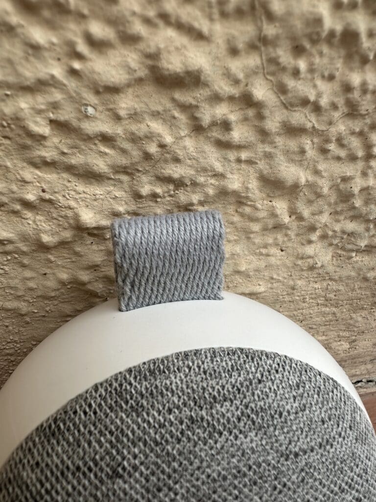 Momcozy portable baby sound machine close up of cloth handle