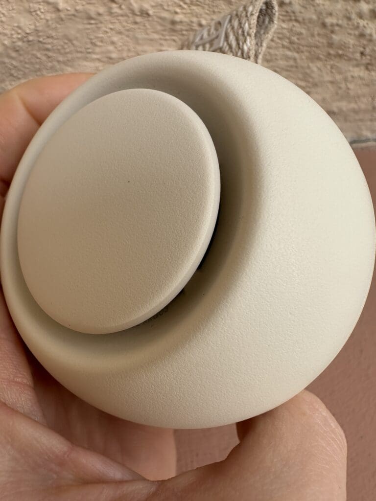 Hatch Go portable baby sound machine hand eco-friendly materials close up of plastic