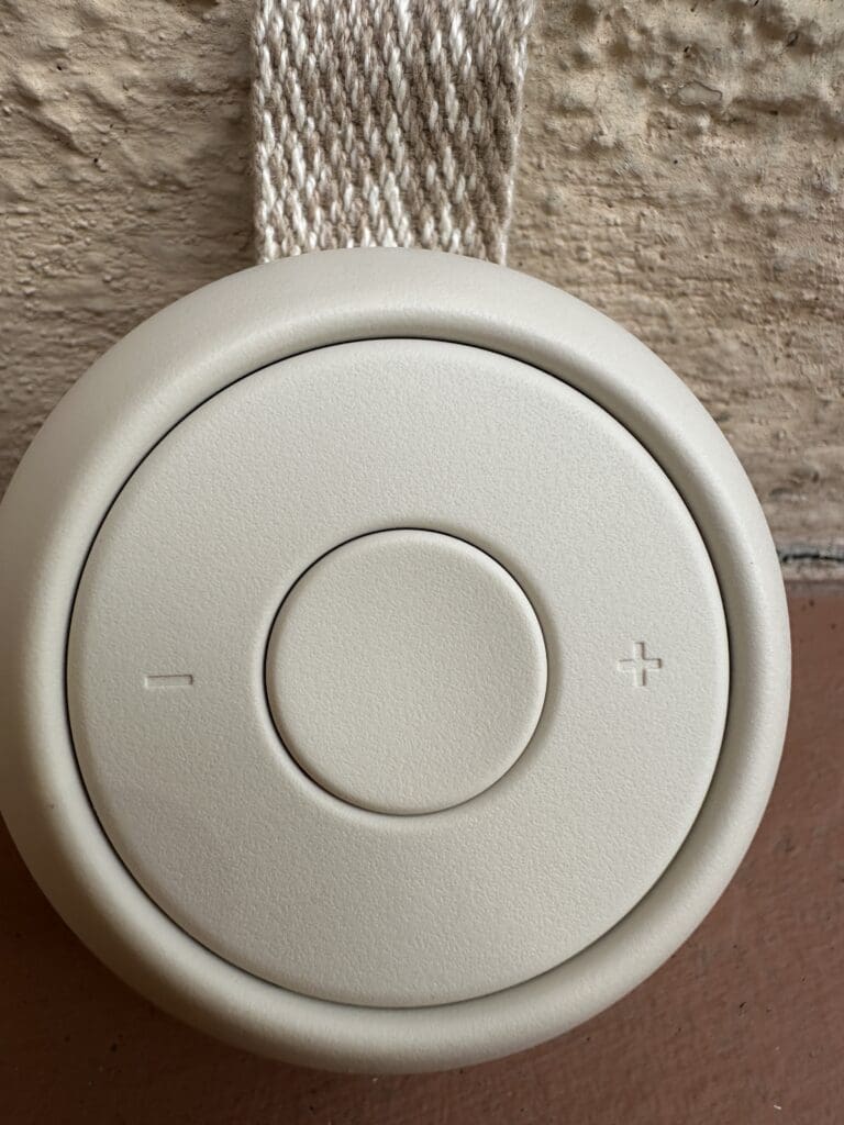 Hatch Go portable baby sound machine zoomed in of buttons and plastic material in greige