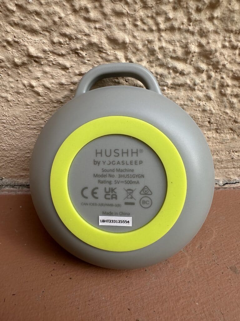 Yogasleep hushh portable baby sound machine up close back showcasing rubber ring