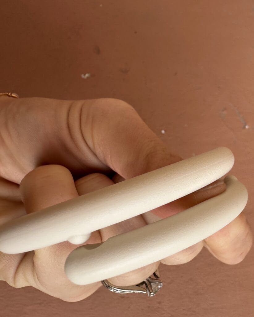 Hatch go portable baby sound machine close up of clip to latch onto device