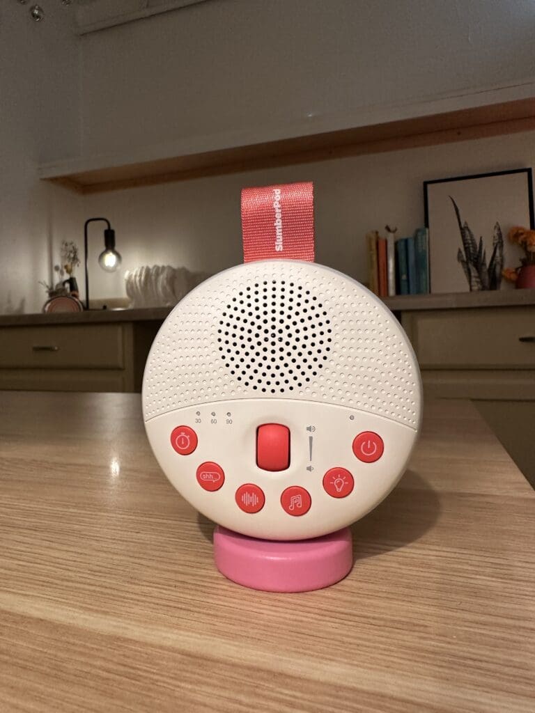SlumberPod Slumbercalm portable baby sound machine up close front sitting on desk